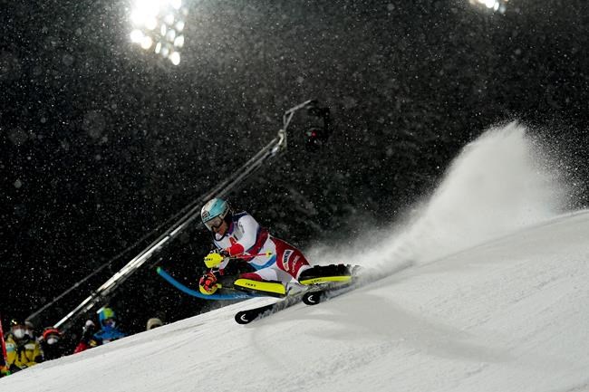 Switzerland's Wendy Holdener speeds down the course during an alpine ski, women's World Cup slalom in Flachau, Austria, Tuesday, Jan. 12, 2021. (AP Photo/Giovanni Auletta)