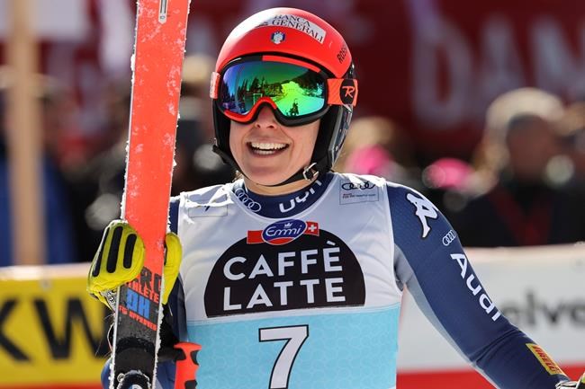 Italy's Federica Brignone gets to the finish area after completing an alpine ski, women's World Cup downhill, in Crans Montana, Switzerland, Saturday, Feb. 22, 2020. (AP Photo/Alessandro Trovati)