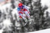 Switzerland's Beat Feuz speeds down the course during an alpine ski, men's World Cup downhill, in Kitzbuehel, Austria, Sunday, Jan. 24, 2021. (AP Photo/Marco Trovati)