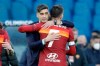 Roma's head coach Paulo Fonseca hugs Federico Pellegrini at the end of the Serie A soccer match between Roma and Spezia at the Rome Olympic Stadium Saturday, Jan. 23, 2021. Roma won 4-3. (AP Photo/Gregorio Borgia)