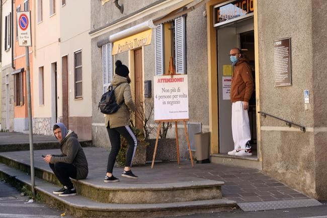 A placard in front of a bakery reads in Italian