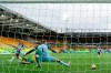 Brighton's Leandro Trossard, left, scores his side's opening goal past Norwich City's goalkeeper Tim Krul during the English Premier League soccer match between Norwich City and Brighton & Hove Albion at Carrow Road Stadium in Norwich, England, Saturday, July 4, 2020. (Richard Heathcote/Pool Photo via AP)