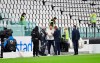 FILE - In this Sunday, Oct. 4, 2020 file photo, Juventus goalie Gianluigi Buffon, centre, stands on the pitch of the Allianz Stadium in Turin, Italy, ahead of the scheduled Serie A soccer match between Juventus and Napoli. Napoli won an appeal on Tuesday against its default 3-0 loss to Juventus and so the match will be rescheduled and the penalty point revoked. Napoli had seen previous appeals rejected and took the matter to the Italian Olympic Committee, which decided in favor of the club. (Tano Pecoraro/LaPresse via AP, File)
