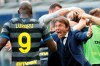 Inter Milan's head coach Antonio Conte and players celebrate after Matteo Darmian scored during the Serie A soccer match between Inter Milan and Hellas Verona, at the San Siro stadium in Milan, Italy, Sunday, April 25, 2021. (AP Photo/Antonio Calanni)