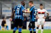 Inter Milan's Romelu Lukaku, left, hands the ball to teammate Sebastiano Esposito to kick a penalty, during a Serie A soccer match between Inter Milan and Genoa, at the San Siro stadium in Milan, Italy, Saturday, Dec. 21, 2019. (AP Photo/Luca Bruno)