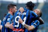 Atalanta's Duvan Zapata celebrates with his teammate Papu Gomez, right, after scoring his side's fourth goal during the Serie A soccer match between Atalanta and Sassuolo at the Gewiss Stadium in Bergamo, Italy, Sunday, June 21, 2020. Atalanta is playing its first match in Bergamo since easing of lockdown measures, in the area that has been the epicenter of the hardest-hit province of Italy's hardest-hit region, Lombardy, the site of hundreds of COVID-19 deaths. (AP Photo/Luca Bruno)