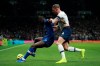 Chelsea's Antonio Rudiger, left, is tackled by Tottenham's Toby Alderweireld during the English Premier League soccer match between Tottenham Hotspur and Chelsea, at the Tottenham Hotspur Stadium in London, Sunday, Dec. 22, 2019. (AP Photo/Ian Walton)