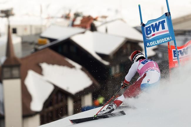 Switzerland's Loic Meillard speeds down the course during an alpine ski, men's World Cup Giant slalom, in Adelboden, Switzerland, Saturday, Jan. 9, 2021. (AP Photo/Gabriele Facciotti)