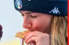 Italy's Marta Bassino kisses the gold medal of the parallel giant slalom, at the alpine ski World Championships in Cortina d'Ampezzo, Italy, Tuesday, Feb.16, 2021. (AP Photo/Giovanni Auletta)