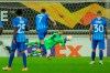 Hoffenheim's goalkeeper Oliver Baumann, background, blocks a penalty kick shot by Gent's Roman Yaremchuk, left, during the Europa League Group L soccer match between Gent and Hoffenheim at the KAA Gent stadium in Gent, Belgium, Thursday, Oct. 29, 2020. (AP Photo/Olivier Matthys)