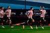 Athletic Bilbao's Raul Garcia, right, celebrates with teammates after scoring the opening goal during Spanish Super Cup semi final soccer match between Real Madrid and Athletic Bilbao at La Rosaleda stadium in Malaga, Spain, Thursday, Jan. 14, 2021. (AP Photo/Jose Breton)