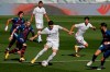Real Madrid's Federico Valverde, center, plays the ball next to Huesca defenders during the Spanish La Liga soccer match between Real Madrid and Huesca at Alfredo di Stefano stadium in Madrid, Spain, Saturday, Oct. 31, 2020. (AP Photo/Manu Fernandez)