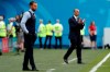 FILE - in this photo taken on Saturday, July 14, 2018, Belgium coach Roberto Martinez, background, applauds behind England head coach Gareth Southgate during the third place match between England and Belgium at the 2018 soccer World Cup in the St. Petersburg Stadium in St. Petersburg, Russia. Martinez has signed a new contract to lead the Red Devils through the 2022 World Cup in Qatar. (AP Photo/Natacha Pisarenko)