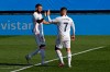 Real Madrid's Eden Hazard, right, celebrates with teammate Karim Benzema after scoring the opening goal during the Spanish La Liga soccer match between Real Madrid and Huesca at Alfredo di Stefano stadium in Madrid, Spain, Saturday, Oct. 31, 2020. (AP Photo/Manu Fernandez)