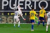 Real Madrid's Karim Benzema, top, heads the ball to score his side's third goal during the Spanish La Liga soccer match between Cadiz and Real Madrid at the Ramon Carranza stadium in Cadiz, Spain, Wednesday, April 21, 2021. (AP Photo/Jose Breton)