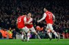 Arsenal's Sokratis Papastathopoulos, left, celebrates with teammate Lucas Torreira and Sead Kolasinac, right, after scoring their side's second goal during the English Premier League soccer match between Arsenal and Manchester United at the Emirates Stadium in London, Wednesday, Jan. 1, 2020. (AP Photo/Matt Dunham)
