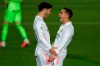 Real Madrid's Marco Asensio, left, celebrates with teammate Lucas Vazquez after scoring his side's second goal during the Spanish La Liga soccer match between Real Madrid and Celta Vigo at the Alfredo Di Stefano stadium in Madrid, Spain, Saturday, Jan. 2, 2021. (AP Photo/Manu Fernandez)