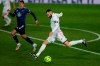 Real Madrid's Karim Benzema shoots the ball during the Spanish La Liga soccer match between Real Madrid and Celta Vigo at the Alfredo Di Stefano stadium in Madrid, Spain, Saturday, Jan. 2, 2021. (AP Photo/Manu Fernandez)