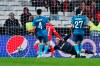 Benfica's Franco Cervi, second left, scores past Zenit goalkeeper Mikhail Kerzhakov the opening goal during the Champions League group G soccer match between Benfica and Zenit St. Petersburg at the Luz stadium in Lisbon, Tuesday, Dec. 10, 2019. (AP Photo/Armando Franca)