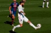 Real Madrid's Sergio Ramos, front, plays the ball next to Huesca's Rafa Mir during the Spanish La Liga soccer match between Real Madrid and Huesca at Alfredo di Stefano stadium in Madrid, Spain, Saturday, Oct. 31, 2020. (AP Photo/Manu Fernandez)