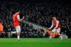 Arsenal's Sokratis Papastathopoulos, left, celebrates with teammate Lucas Torreira after scoring their side's second goal during the English Premier League soccer match between Arsenal and Manchester United at the Emirates Stadium in London, Wednesday, Jan. 1, 2020. Papastathopoulos scored once in Arsenal's 2-0 victory. (AP Photo/Matt Dunham)