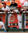 FILE - In this Aug. 7, 2008, file photo, Cincinnati Reds manager Dusty Baker, left, watches a baseball game against the Houston Astros in the dugout with son Darren in Cincinnati. Darren Baker considers his father the perfect person to take over the Houston Astros, and the college second baseman insists that's from a baseball player perspective not just as a proud son. 
