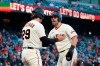 San Francisco Giants' Michael Tauchman (29) and Curt Casali celebrate after both scored on a single by Brandon Belt against the Colorado Rockies during the second inning of a baseball game in San Francisco on Wednesday, April 28, 2021. (AP Photo/Jeff Chiu)