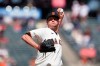 San Francisco Giants pitcher Jake McGee throws to a Cincinnati Reds batter during the ninth inning of a baseball game in San Francisco, Wednesday, April 14, 2021. (AP Photo/Jeff Chiu)
