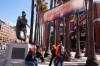 People wait by the statue of baseball great Willie Mays for the gates at Oracle Park to open before the start of an opening day baseball game between the San Francisco Giants and the Colorado Rockies, Friday, April 9, 2021, in San Francisco. (AP Photo/Eric Risberg)