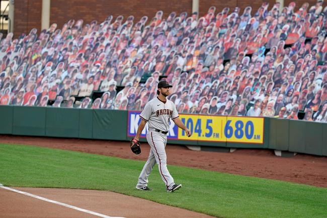 Arizona Diamondbacks starting pitcher Madison Bumgarner walks from the bullpen to the dugout before the team's baseball game against the San Francisco Giants on Saturday, Sept. 5, 2020, in San Francisco. (AP Photo/Eric Risberg)