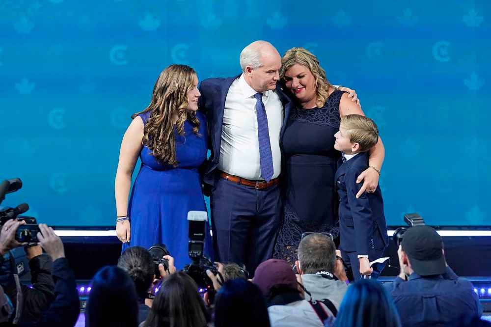 Conservative Leader Erin O'Toole arrives with his wife Rebecca, daughter Mollie and son Jack as he prepares to give his concession speech at his election night headquarters during the Canadian federal election in Oshawa, Ont., on Tuesday, September 21, 2021. THE CANADIAN PRESS/Adrian Wyld