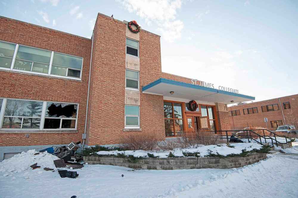 Parents and students of St. James Collegiate and George Waters Middle School will be advised later Monday about whether damage from Sunday’s fire in the high-school section will require classes to be cancelled again Tuesday. Winter break is set to begin on Wednesday. (Mike Sudoma / Winnipeg Free Press)