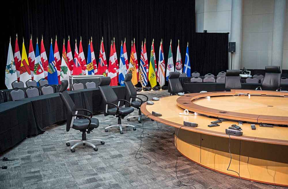 Swivel chairs surround a table in the Ottawa meeting room where Prime Minister Justin Trudeau was set to attend the First Ministers' Meeting before it was cancelled due to the COVID-19 outbreak. (Justin Tang / The Canadian Press)