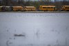 School buses parked in a lot surrounded on three sides by flood watersalong Provincial Road 200 south of Winnipeg on Saturday. (Daniel Crump / Winnipeg Free Press)
