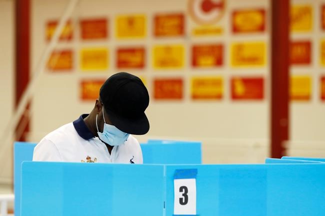 A voters casts his ballot to vote at Clarke Central High School in Athens, Ga., on Election Day, Tuesday, Nov. 3, 2020. (Joshua L. Jones/Athens Banner-Herald via AP)