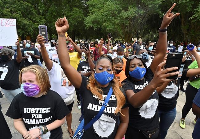 Protesters gather outside the Glynn County Courthouse during a rally to protest the shooting of Ahmaud Arbery, Saturday, May 16, 2020, in Brunswick, Ga. (Hyosub Shin/Atlanta Journal-Constitution via AP)