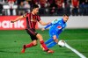 Atlanta United's Gonzalo Martinez, left, knocks the ball in for a goal as Motagua's Omar Elvir defends during the second half of CONCACAF Champions League soccer match Tuesday, Feb. 25, 2020, in Kennesaw, Ga. (John Amis/Atlanta Journal-Constitution via AP)