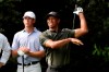 Tiger Woods tees off on the 14th hole as Andy Ogletree watches during the first round of the Masters golf tournament Thursday, Nov. 12, 2020, in Augusta, Ga. (Curtis Compton/Atlanta Journal-Constitution via AP)