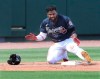 Atlanta Braves Abraham Almonte claps his hands giving himself applause getting into third base for a leadoff triple against the Minnesota Twins during the second inning of an MLB spring training game Tuesday, March 2, 2021, in North Port. (Curtis Compton/Atlanta Journal-Constitution via AP)