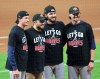 Atlanta Braves starting pitchers, from left, Max Fried, catcher Travis d'Arnaud, Ian Anderson, and Kyle Wright pose as the Braves celebrate advancing to the NL Championship Series by defeating the Marlins 7-0 in Game 3 of a Division Series, Thursday, Oct. 8, 2020, in Houston. (Curtis Compton/Atlanta Journal-Constitution via AP)