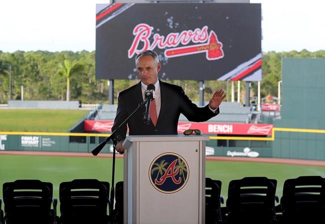 Baseball Commissioner Rob Manfred takes questions about the Houston Astros during a news conference at the Atlanta Braves' spring training facility Sunday, Feb. 16, 2020, in North Port, Fla. (Curtis Compton/Atlanta Journal-Constitution via AP)