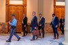 Lead by a Georgia State Trooper, Georgia Secretary of State Brad Raffensperger, center, exits the Georgia State Capitol building after hearing reports of threats, Wednesday, Jan. 6, 2021, in Atlanta. (Alyssa Pointer/Atlanta Journal-Constitution via AP)