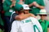 Dustin Johnson reacts with his brother and caddie Austin Johnson on the 18th green after winning the Masters golf tournament Sunday, Nov. 15, 2020, in Augusta, Ga. (Curtis Compton/Atlanta Journal-Constitution via AP)