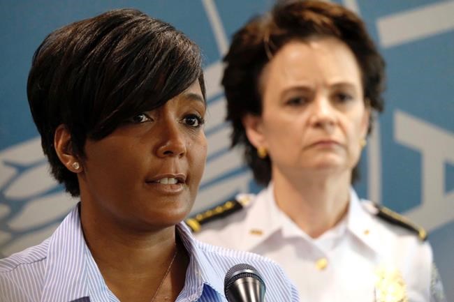 Atlanta Mayor Keisha Lance Bottoms announces a 9 p.m. curfew as protests continue over the death of George Floyd, Saturday, May 30, 2020, in Atlanta. Protests were held in U.S. cities over the death of Floyd, a black man who died after being restrained by Minneapolis police officers on May 25. (Ben Gray/Atlanta Journal-Constitution via AP)