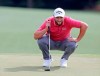 Jon Rahm looks over his putt on the 18th green during the final round of the Masters golf tournament at Augusta National, Sunday, April 11, 2021, in Augusta, Ga. (Curtis Compton/Atlanta Journal-Constitution via AP)