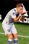 Orlando City forward Chris Mueller, celebrates after scoring a goal during the first half of an MLS soccer match against Atlanta United on Saturday, Aug. 29, 2020, in Atlanta. (AP Photo/Brynn Anderson)