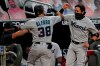 Miami Marlins' Jorge Alfaro, left, celebrates with Miguel Rojas, right, after Alfaro hits a home run during the third inning of the team's baseball game against the Atlanta Braves on Tuesday, Sept. 8, 2020, in Atlanta. (AP Photo/Brynn Anderson)