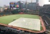 The outfield at Truist Park takes on a white cast during a hail storm prior to a baseball game between the Atlanta Braves and the Arizona Diamondbacks, Saturday, April 24, 2021, in Atlanta. Thunderstorms were were forecast in Atlanta in the early evening. (AP Photo/Ben Margot)