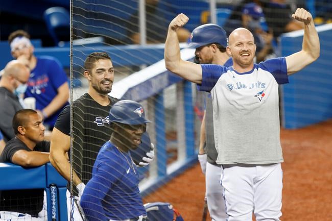 Toronto Blue Jays Derek Fisher (23) flexes his arms during batting practice at summer training in Toronto, Sunday, July 19, 2020. An expanded playoff structure for the truncated 2020 baseball season has given the Toronto Blue Jays more reason to focus on the present as well as the future. THE CANADIAN PRESS/Cole Burston
