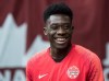 Alphonso Davies and Sophie Schmidt have been named Canada Soccer's Players of the Month for July after helping their teams lift trophies. Canada's Alphonso Davies, who isn't playing due to an injury, watches as his teammates warm up before a CONCACAF Nations League qualifying soccer match against French Guiana in Vancouver, on Sunday March 24, 2019. THE CANADIAN PRESS/Darryl Dyck